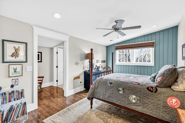 a bedroom with a bed furniture and a window