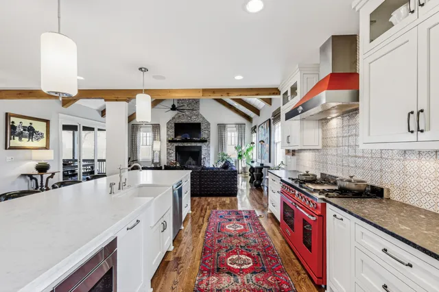 a kitchen with stainless steel appliances kitchen island granite countertop a sink and cabinets
