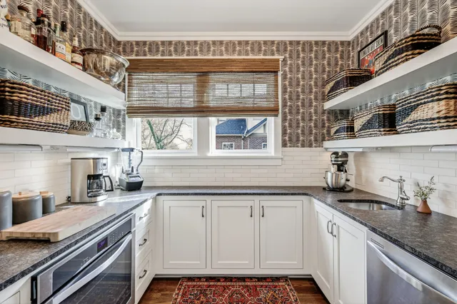 a kitchen with a sink and cabinets