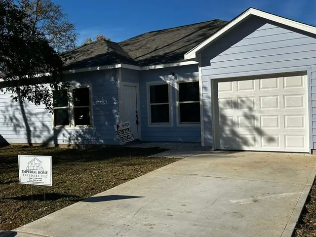 a view of a house with a garden