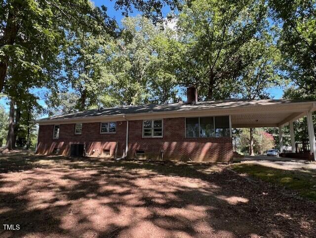 5629 Tabbs Creek Road Oxford, NC 27565 - Photo 12 of 40 a view of a house with backyard and sitting area