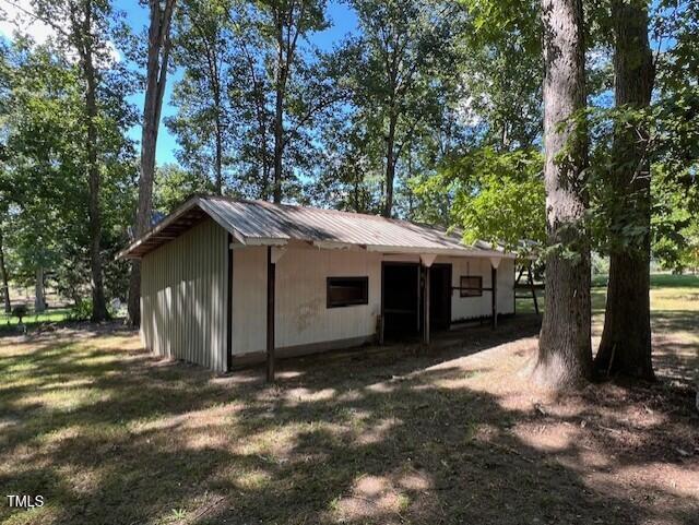 5629 Tabbs Creek Road Oxford, NC 27565 - Photo 13 of 40 a view of a house with a yard and large tree