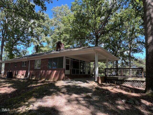 5629 Tabbs Creek Road Oxford, NC 27565 - Photo 17 of 40 a view of a barn with a yard