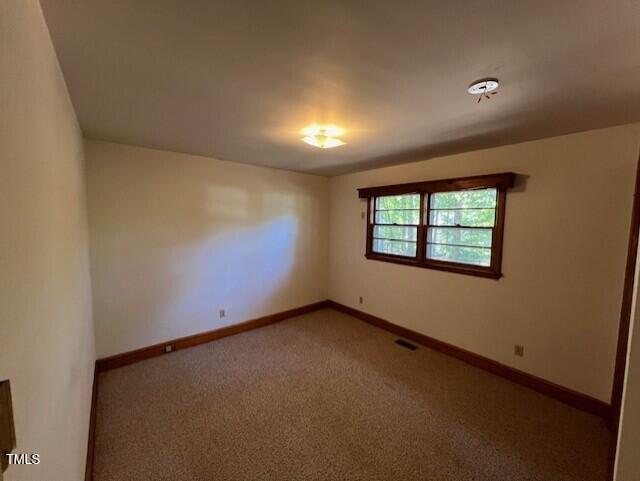5629 Tabbs Creek Road Oxford, NC 27565 - Photo 25 of 40 an empty room with windows
