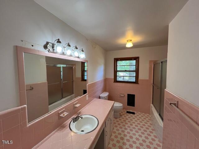 5629 Tabbs Creek Road Oxford, NC 27565 - Photo 28 of 40 a bathroom with a sink mirror vanity and toilet