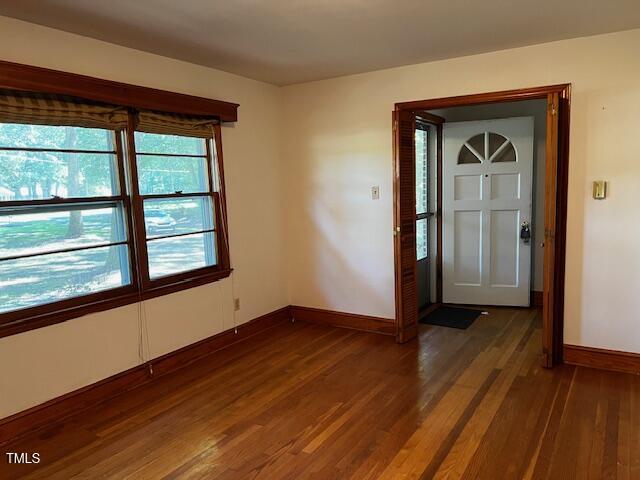 5629 Tabbs Creek Road Oxford, NC 27565 - Photo 38 of 40 a view of an empty room with wooden floor and a window