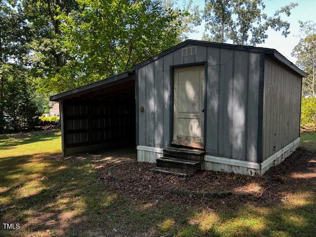 5629 Tabbs Creek Road Oxford, NC 27565 - Photo 39 of 40 a view of a small house with wooden fence