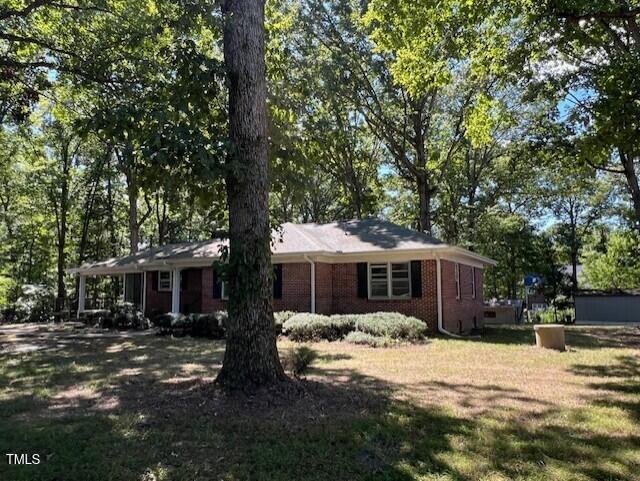 5629 Tabbs Creek Road Oxford, NC 27565 - Photo 5 of 40 a front view of a house with a yard
