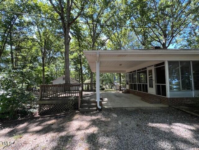 5629 Tabbs Creek Road Oxford, NC 27565 - Photo 8 of 40 a view of a house with a yard and sitting area