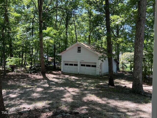 5629 Tabbs Creek Road Oxford, NC 27565 - Photo 10 of 40 a view of a house with a yard and large tree