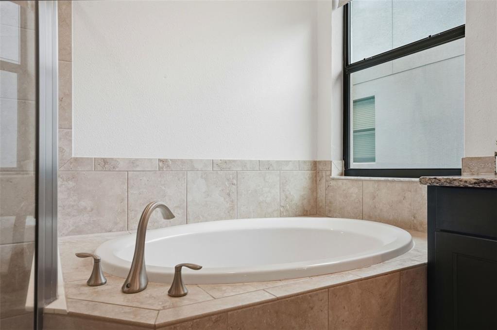 12417 Coralbean Court New Port Richey, FL 34654 - Photo 25 of 64 a bathroom with a sink