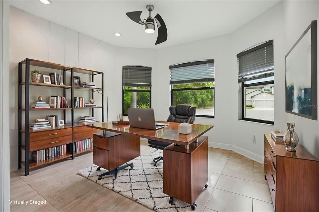12417 Coralbean Court New Port Richey, FL 34654 - Photo 27 of 64 a view of a workspace with furniture and a window
