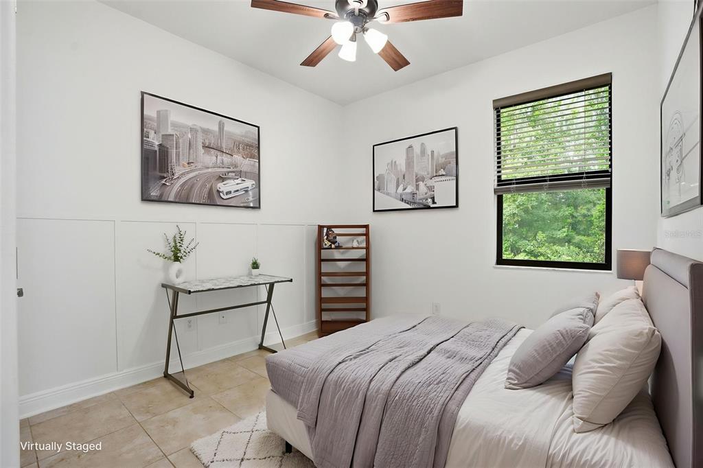 12417 Coralbean Court New Port Richey, FL 34654 - Photo 32 of 64 a bedroom with a bed and a painting on the wall