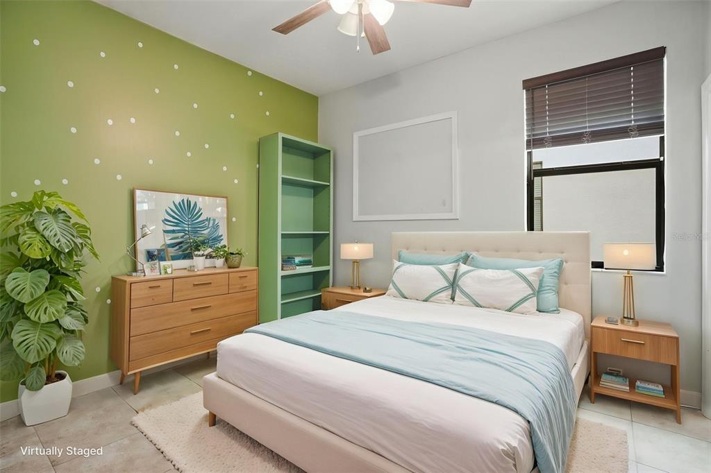 12417 Coralbean Court New Port Richey, FL 34654 - Photo 35 of 64 a bedroom with a bed and a window