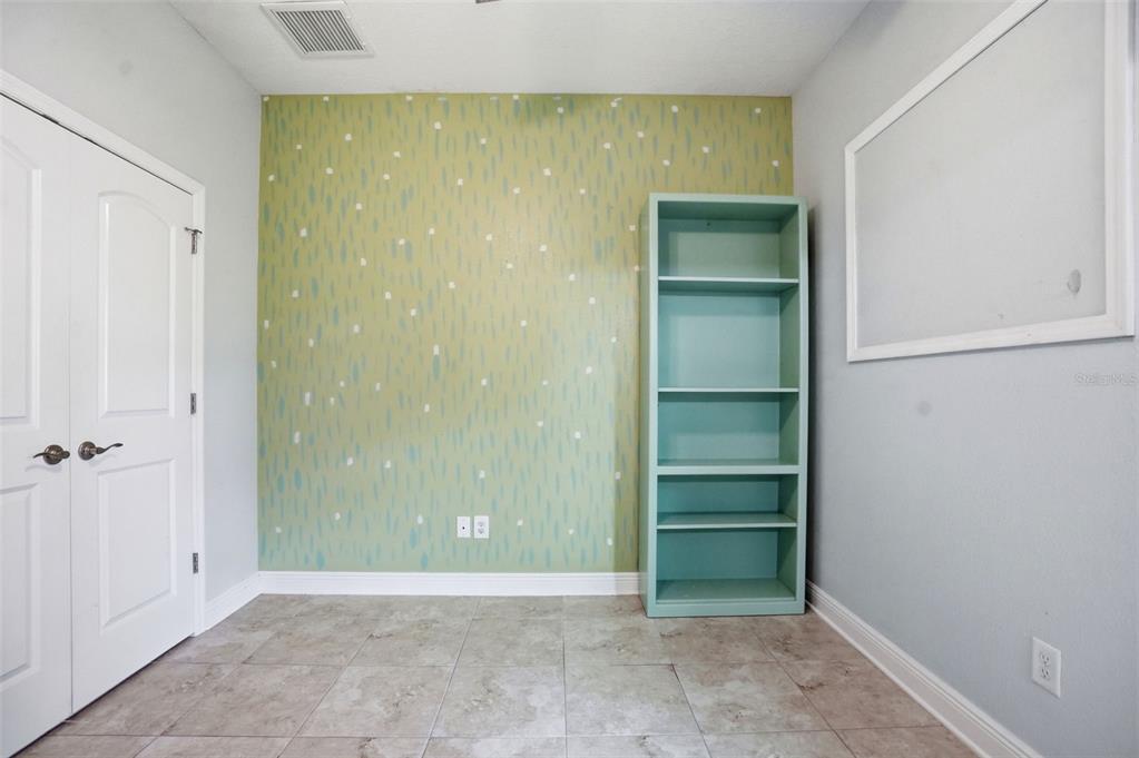 12417 Coralbean Court New Port Richey, FL 34654 - Photo 36 of 64 a view of an empty room with closet and a window