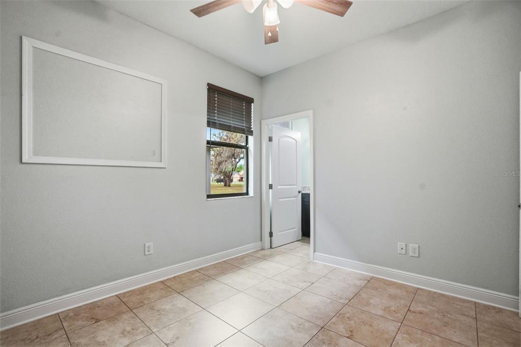 12417 Coralbean Court New Port Richey, FL 34654 - Photo 37 of 64 an empty room with windows and fan