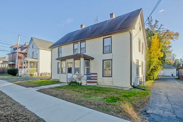a front view of a house with a yard