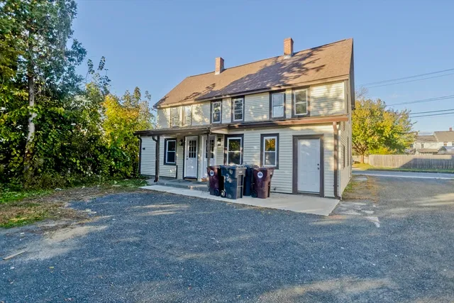 a view of a house with backyard porch and sitting area