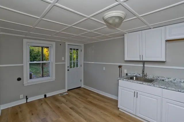 a room with a sink and a window