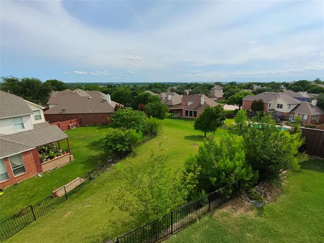 an aerial view of a house with a garden