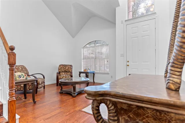 a bedroom with furniture and a window