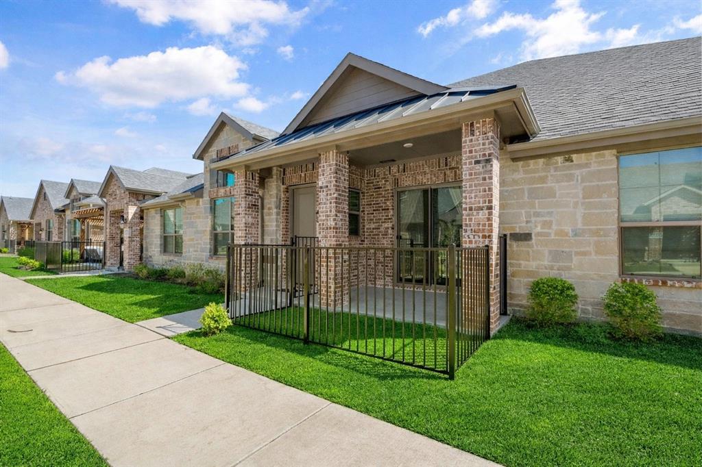 3781 Rochelle Court Prosper, TX 75078 - Photo 2 of 30 View of front of home with brick siding, a standing seam roof, a residential view, and a patio area