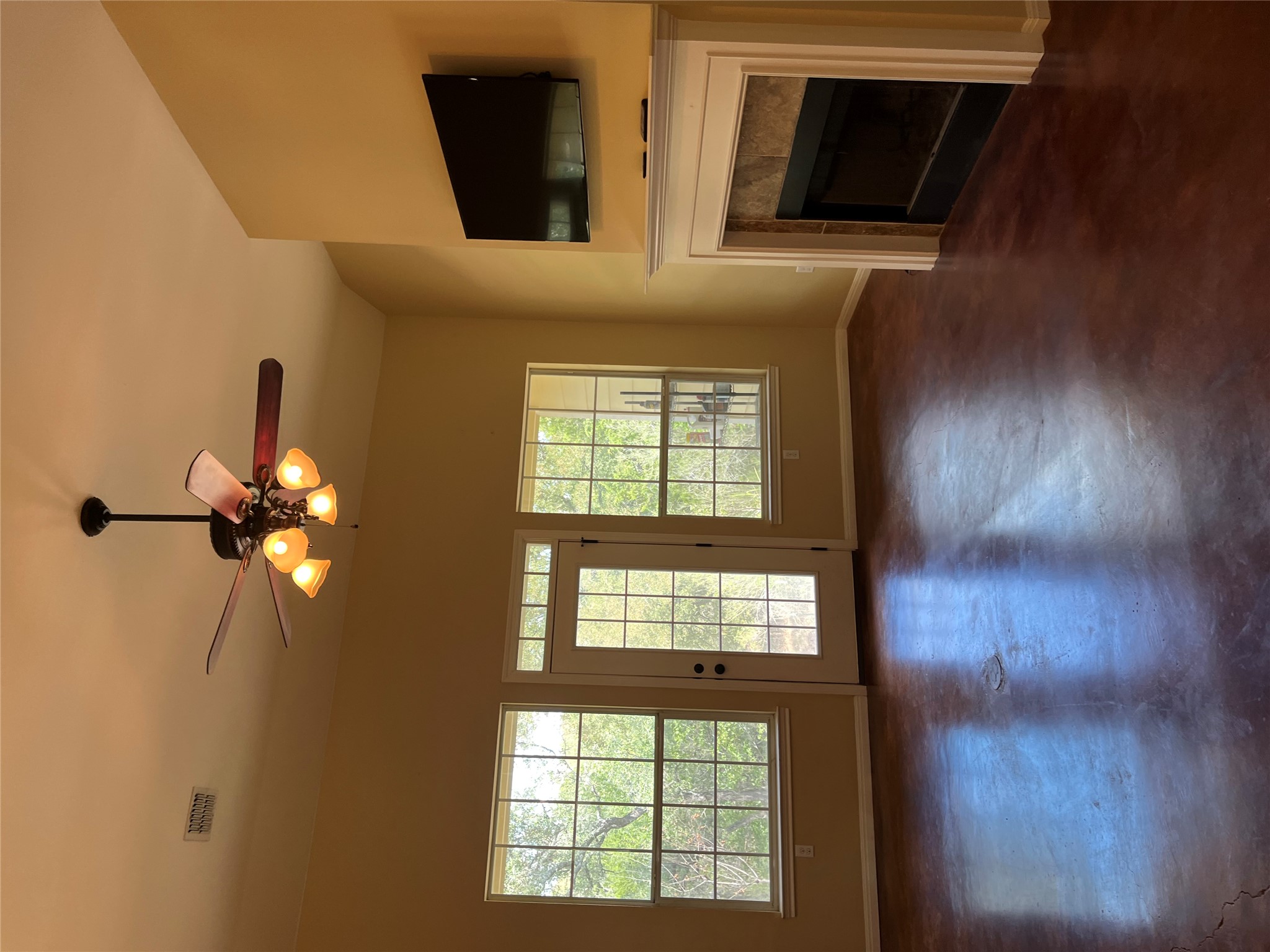 205 Homestead Road Kyle, TX 78640 - Photo 6 of 28 Bright and open living area with windows all along the back wall that transition to the private backyard.