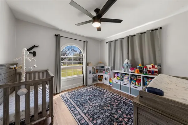 a bed room with furniture and a window