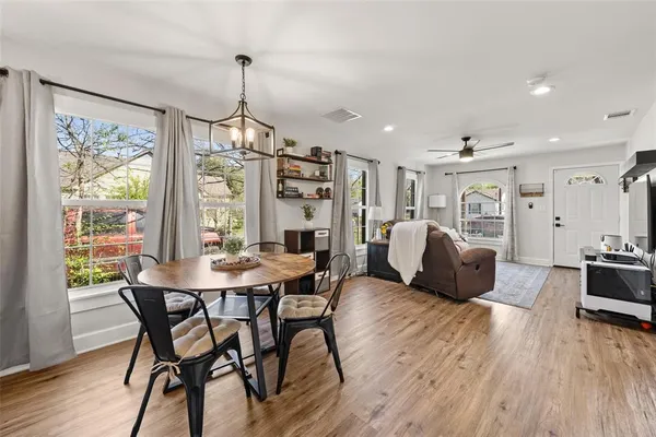 a view of a dining room with furniture window and wooden floor