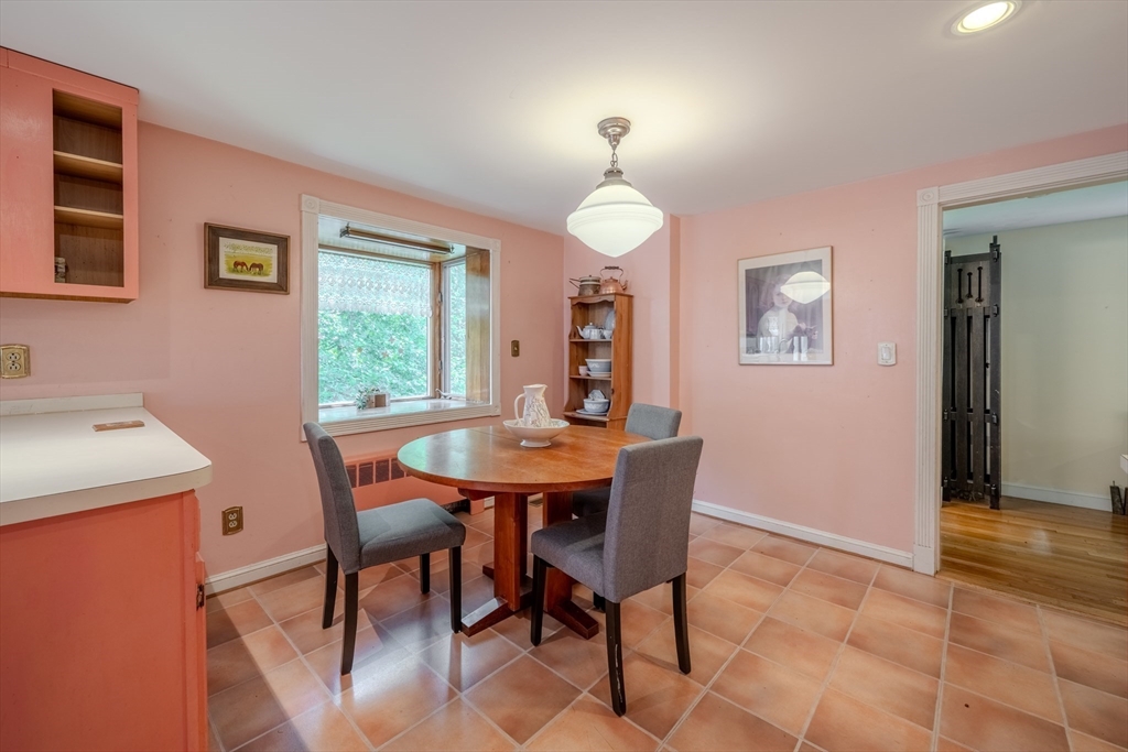75 Ridge Street Arlington, MA 02474 - Photo 12 of 33 a view of a dining room with furniture and a chandelier