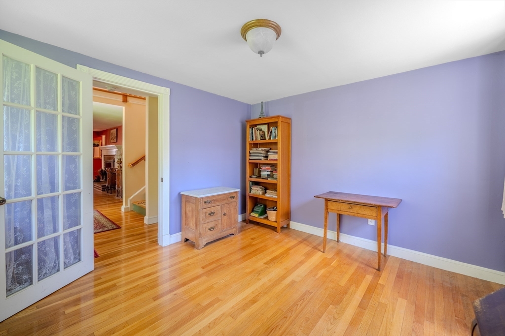 75 Ridge Street Arlington, MA 02474 - Photo 14 of 33 a bedroom with a bed and a table