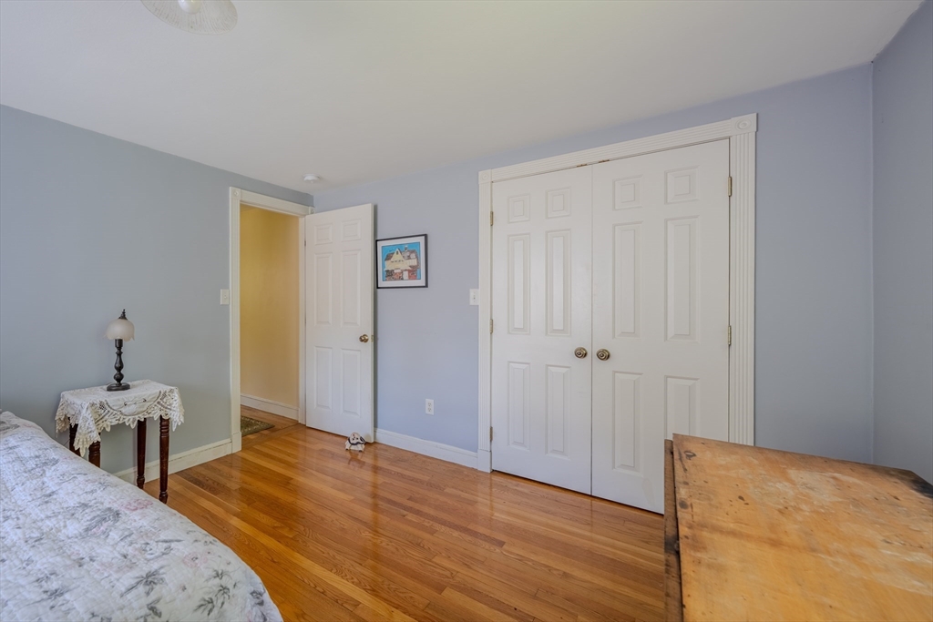 75 Ridge Street Arlington, MA 02474 - Photo 17 of 33 a view of a bedroom with wooden floor