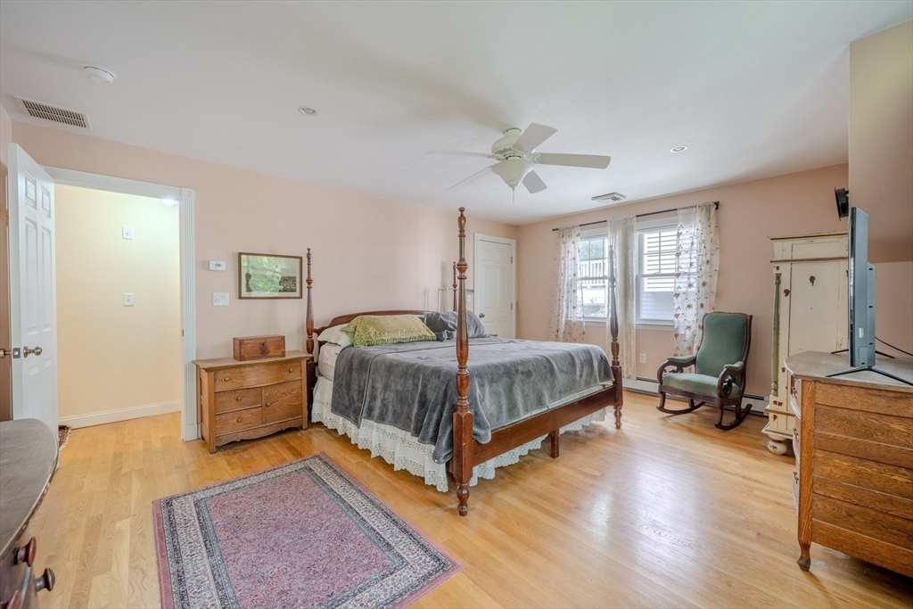 75 Ridge Street Arlington, MA 02474 - Photo 18 of 33 a bedroom with a bed couch and a window