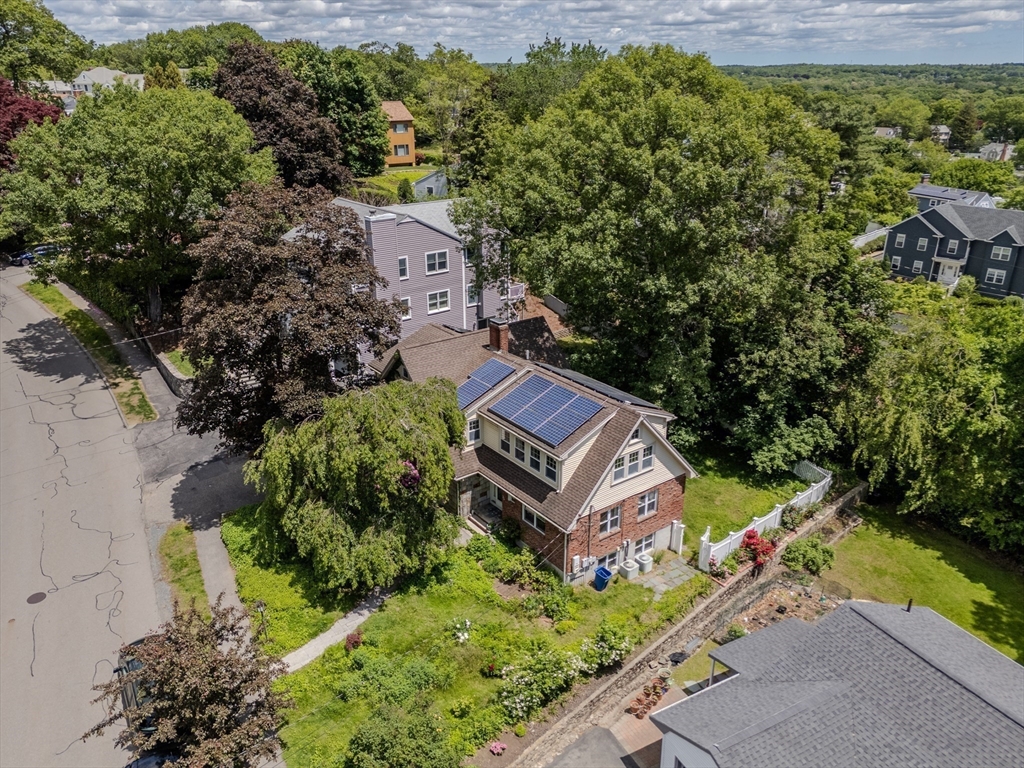 75 Ridge Street Arlington, MA 02474 - Photo 28 of 33 an aerial view of a house with a garden and trees