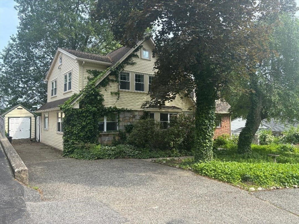 75 Ridge Street Arlington, MA 02474 - Photo 3 of 33 a front view of a house with garden