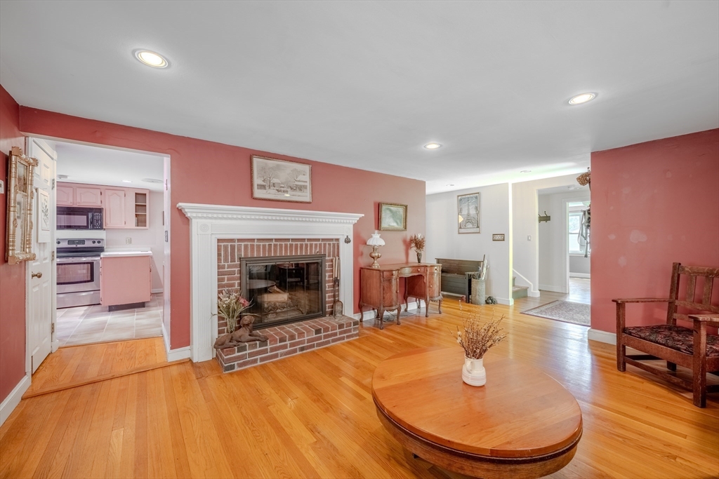 75 Ridge Street Arlington, MA 02474 - Photo 6 of 33 a living room with furniture and a fireplace