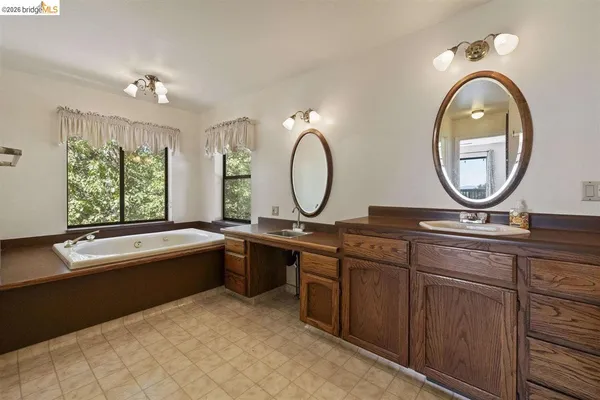 a bathroom with a bathtub and window