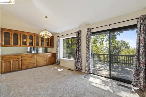 a view of livingroom with hardwood floor and a ceiling fan