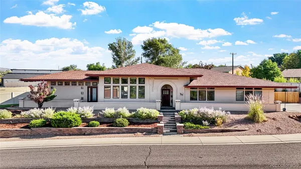front view of a house with a garden