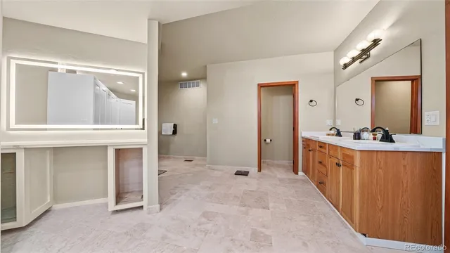 a large bathroom with a sink and mirror