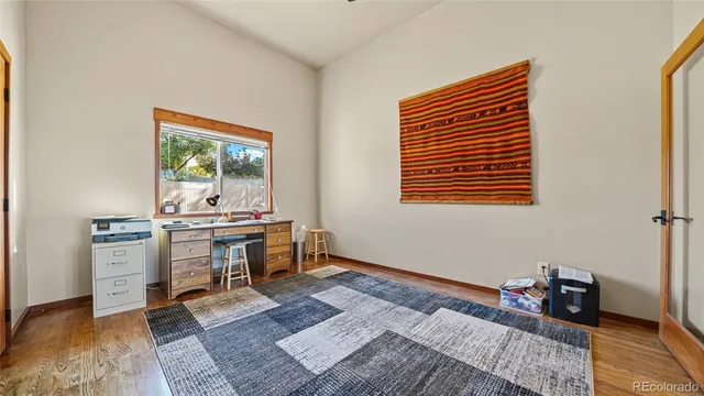 a work room with furniture and a window