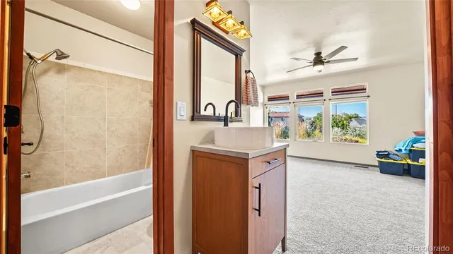 a bathroom with a bathtub and a shower