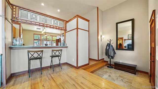 a view of a entryway door with wooden floor