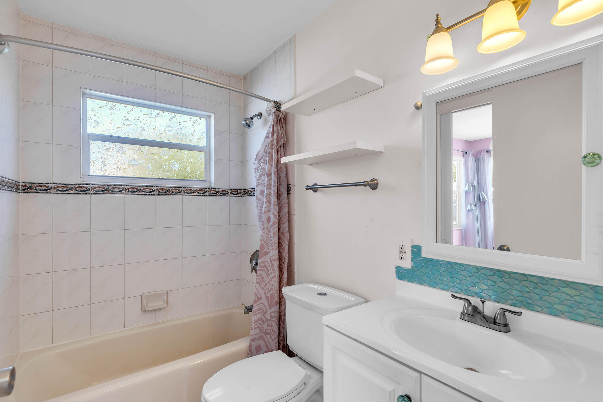 37 Orange Drive Key Largo, FL 33037 - Photo 16 of 32 a bathroom with a sink toilet and shower