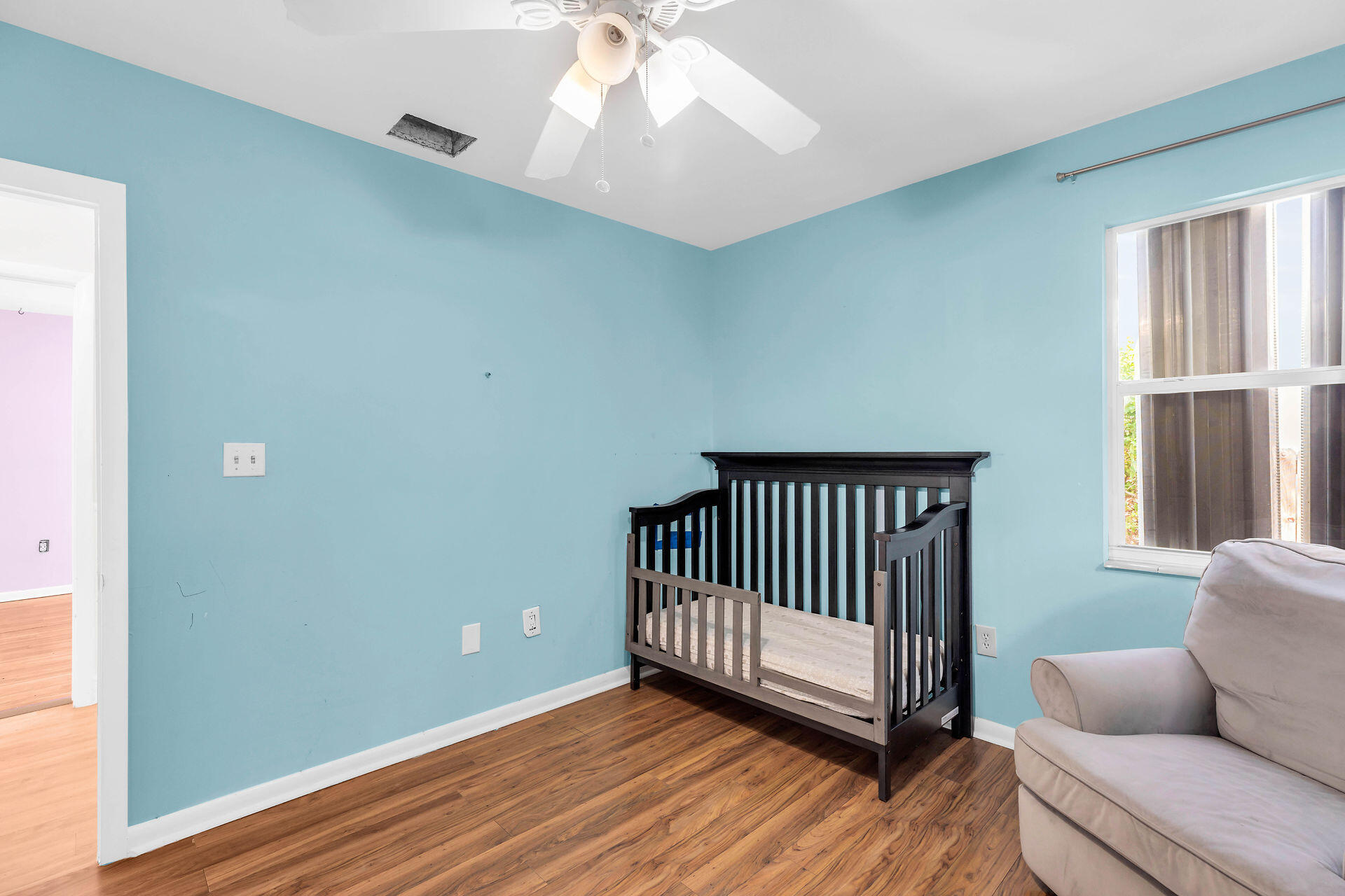37 Orange Drive Key Largo, FL 33037 - Photo 18 of 32 a view of a livingroom with wooden floor and a window