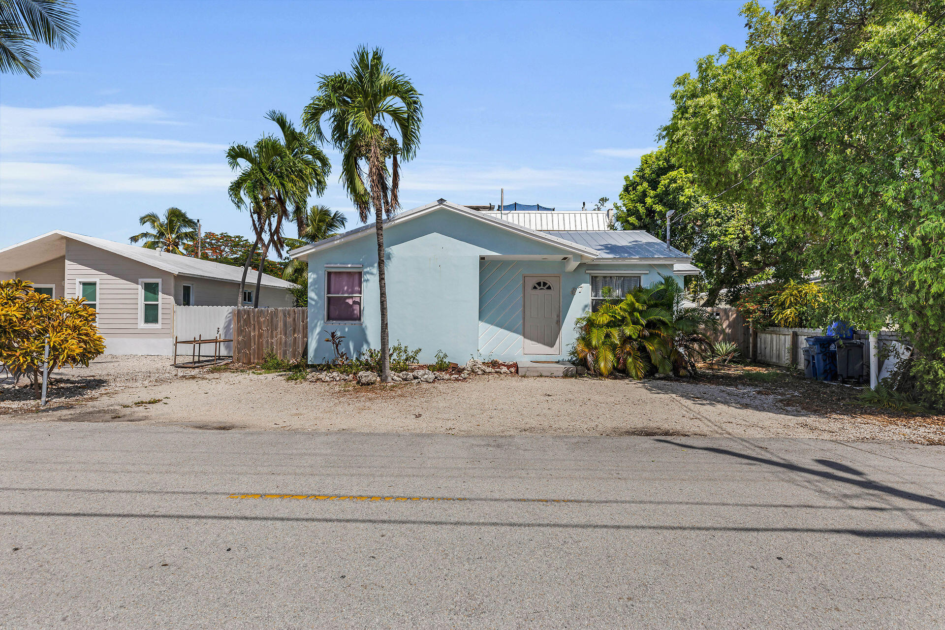 37 Orange Drive Key Largo, FL 33037 - Photo 26 of 32 a front view of a house with a garden