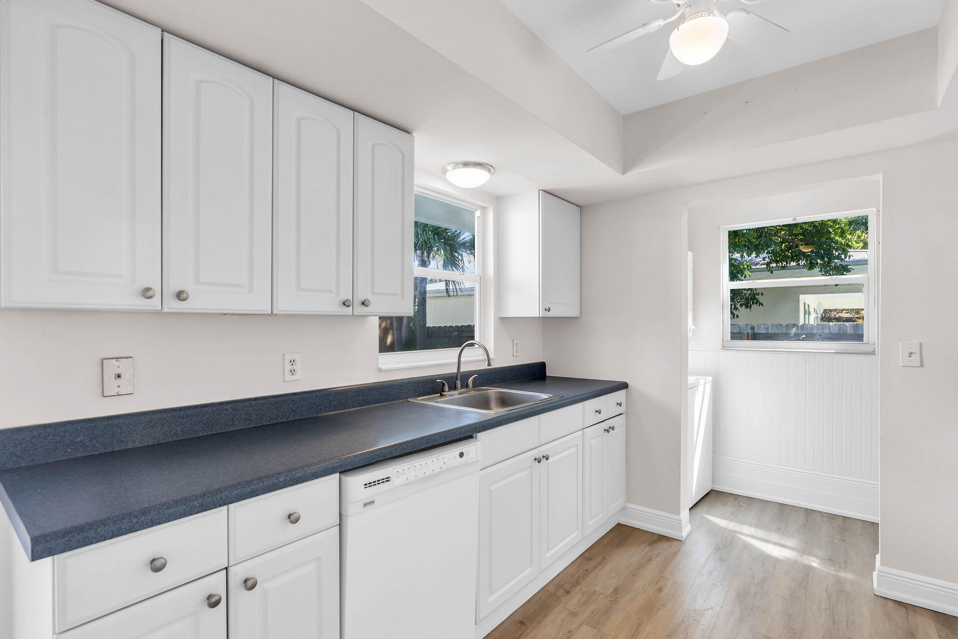 37 Orange Drive Key Largo, FL 33037 - Photo 7 of 32 a kitchen with granite countertop white cabinets and white appliances