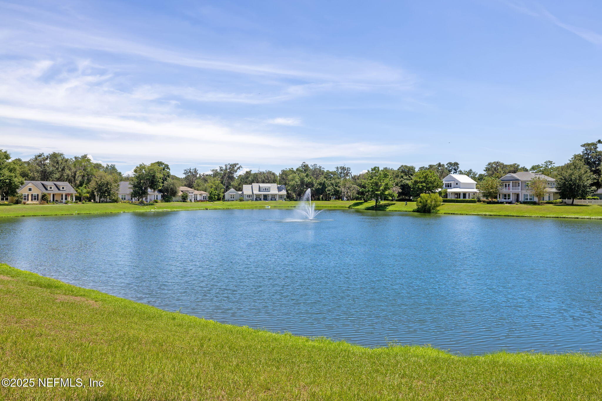 28886 Grandview Manor Yulee, FL 32097 - Photo 12 of 35 a view of a lake with houses in the back