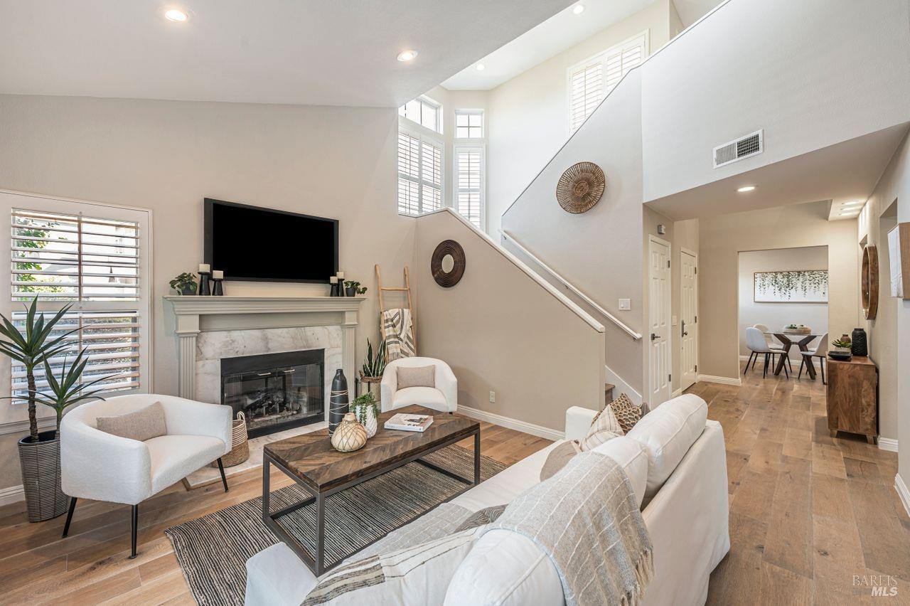 39 Mariners Circle San Rafael, CA 94903 - Photo 1 of 1 a living room with furniture a flat screen tv and a fireplace