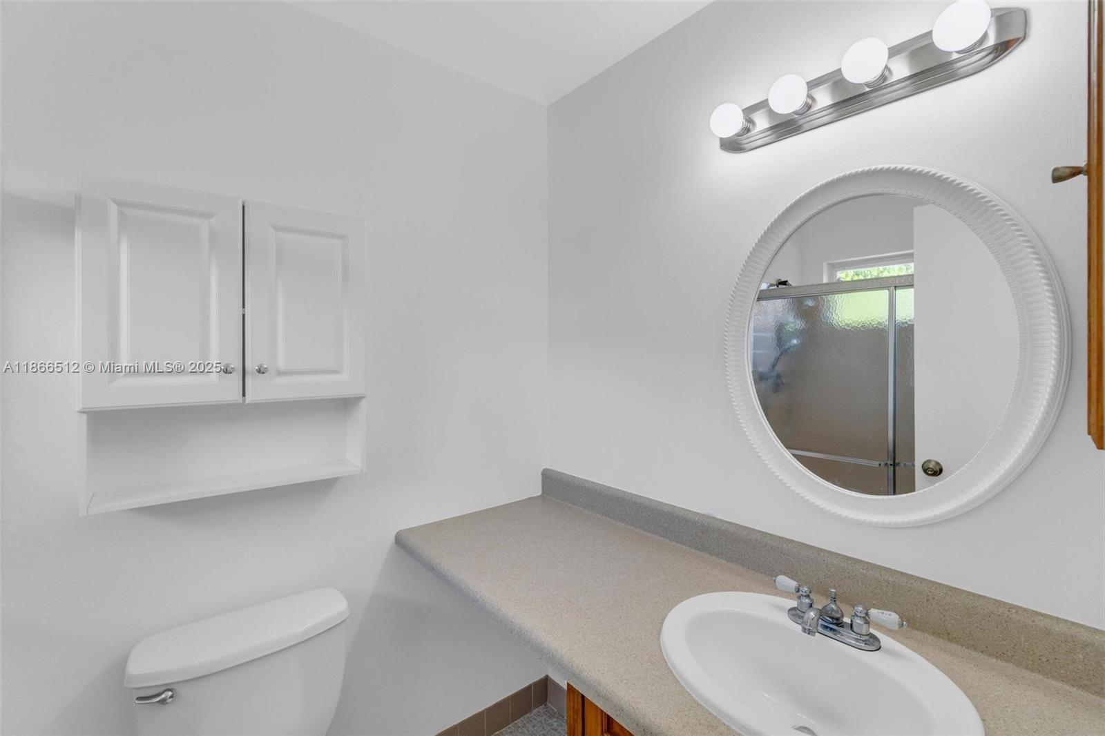 13440 Southwest 81st Street Miami, FL 33183 - Photo 13 of 23 a bathroom with a sink and a mirror